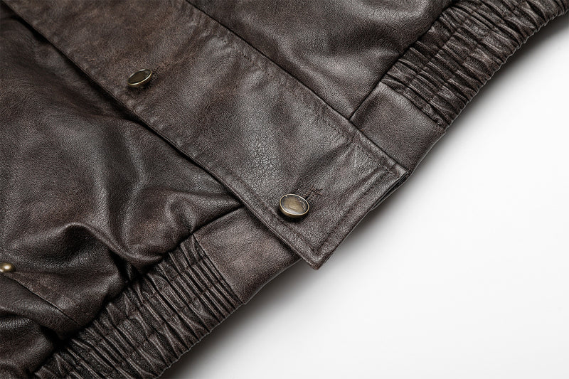 Close-up of brown faux leather jacket hem ribbing and snap-fastened front flap