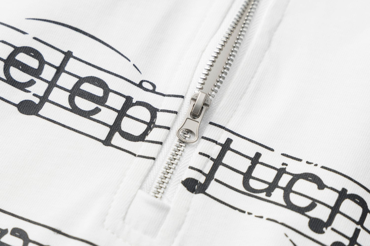 Chemise légère à manches longues, col montant, demi-zip, imprimé partition et chaîne