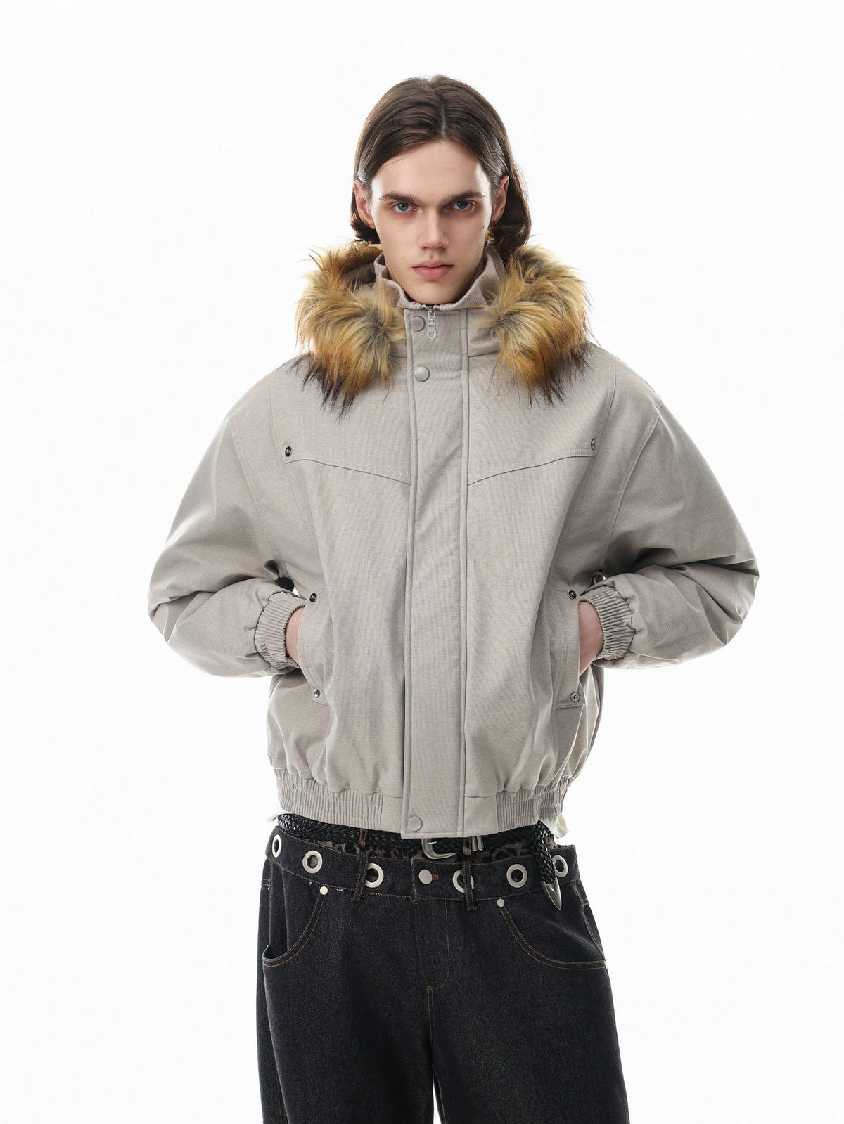 Oversized padded bomber jacket with faux-fur collar in oat beige, worn with wide-leg dark jeans