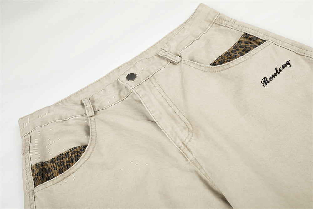 Pantalones de Pierna Ancha con Patchwork de Leopardo – Corte Baggy Deconstruido y Bajo Curvado