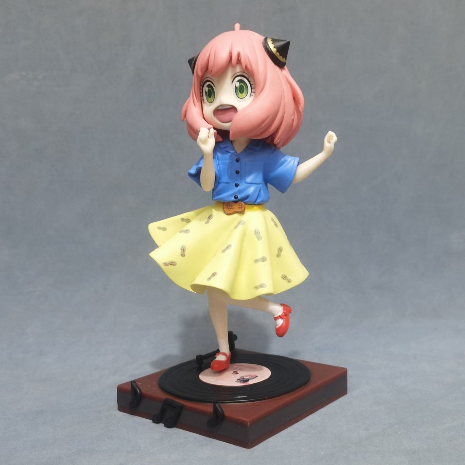 The Anya Forger Dancing Figure, an 18cm limited edition PVC collectible from Spy × Family, features a pink-haired character with cat ear accents in pigtails. She&