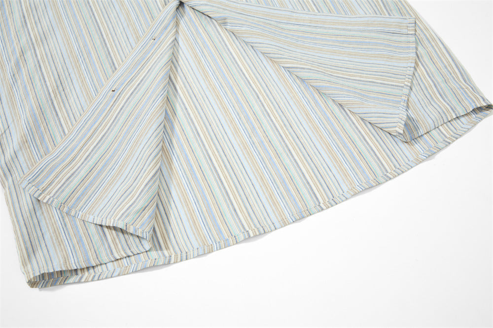 Close-up of striped shirt sleeve and side hem seam