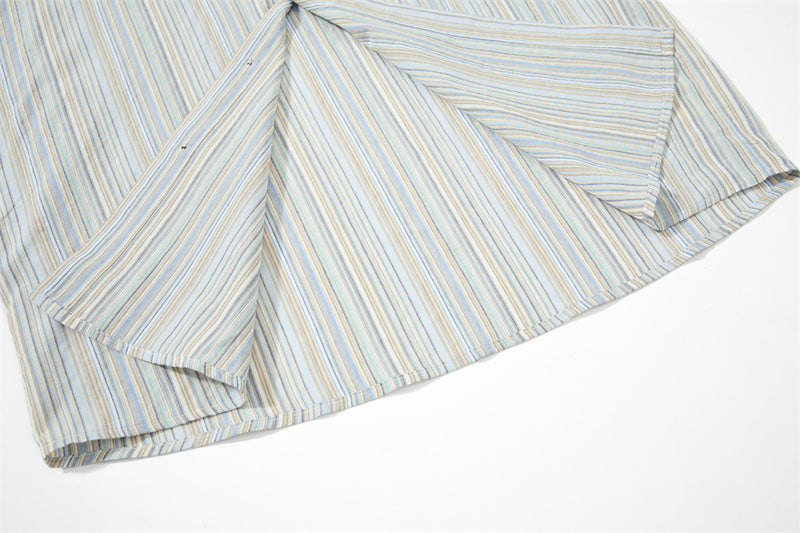 Close-up of striped shirt sleeve and side hem seam