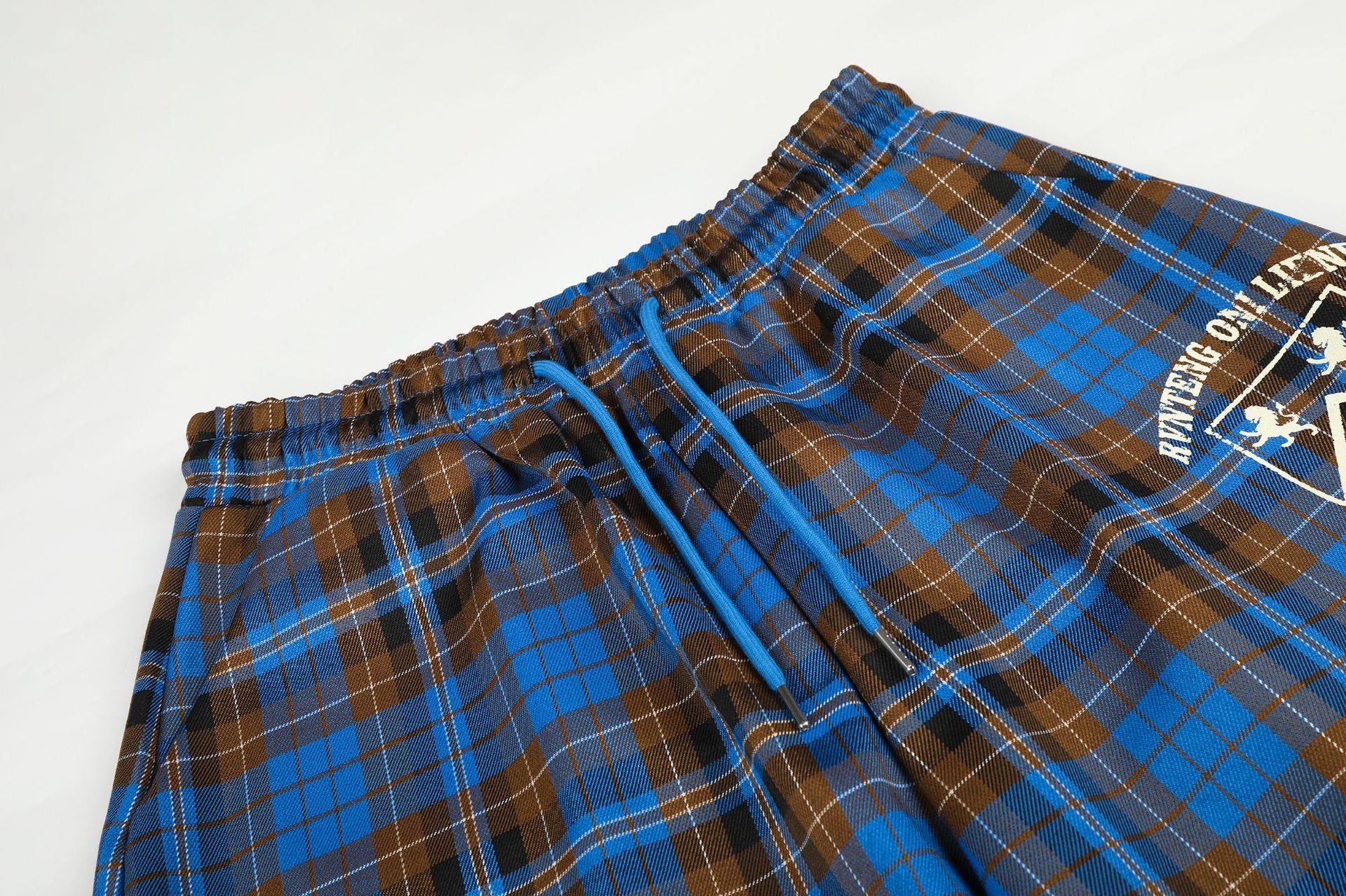 Wide-Leg Plaid Pants – Blue Tartan Baggy Fit with Crest Graphic & Drawstring Hem