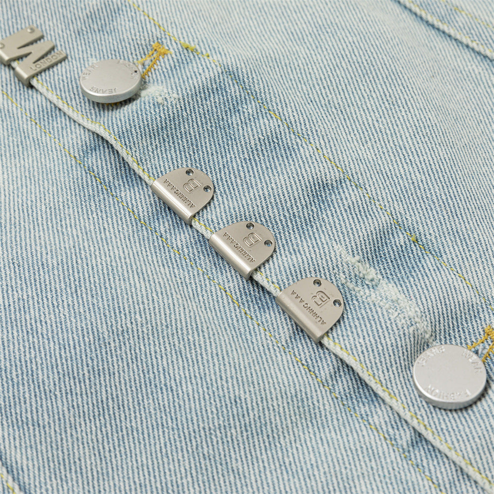 Close-up of the jacket front placket showing multiple silver-tone metal tabs and round buttons