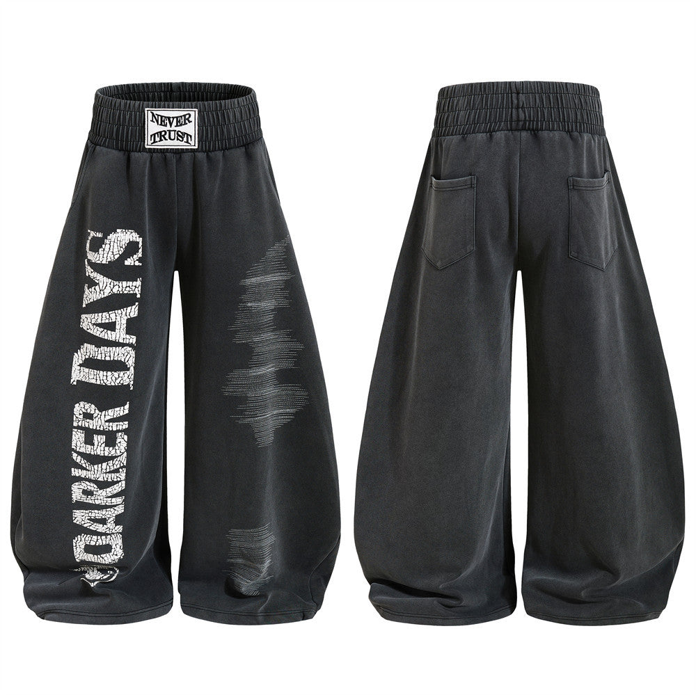 Men's wide-leg charcoal sweatpants with cracked Darker Days vertical print and distressed lightning bolt graphic