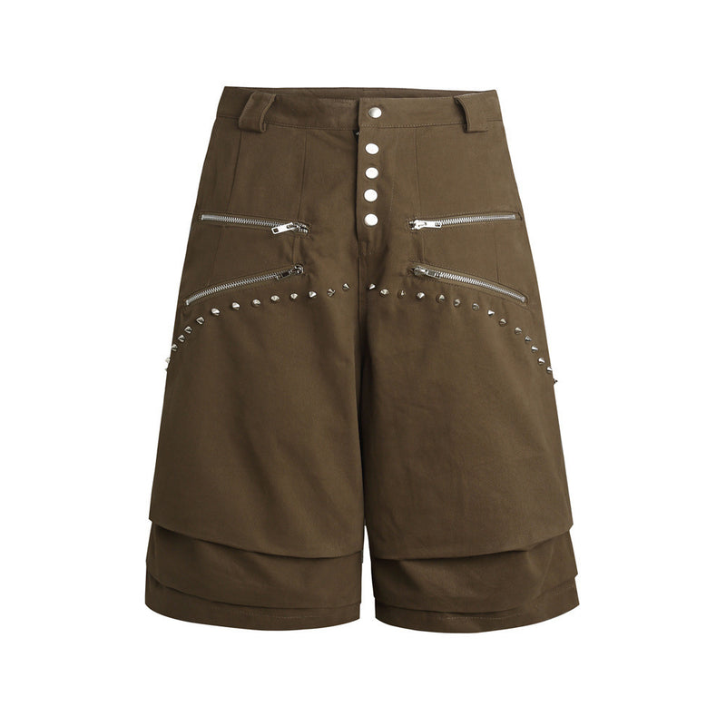 Men's baggy wide-leg shorts in army green with multi-zipper front, pyramid stud trim, snap-button fly, and layered hem