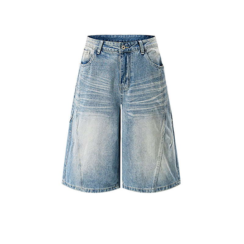 Front view of light blue baggy jean shorts with faded whiskering and wide-leg cut