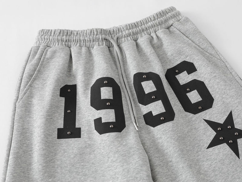 Pantalon de survêtement à jambes larges clouté d’étoiles 1996 avec détail à trois bandes