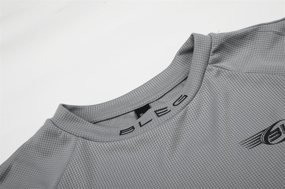 Close-up of gray crew neck collar with BLEG lettering on the neckline