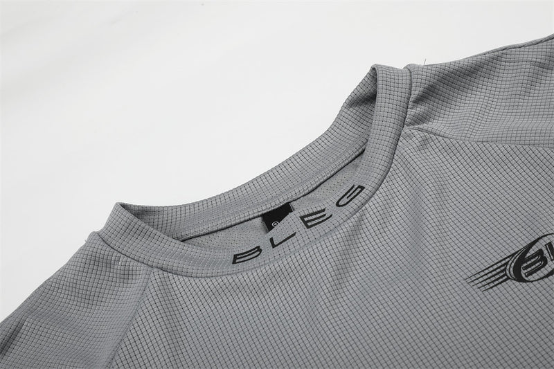 Close-up of gray crew neck collar with BLEG lettering on the neckline