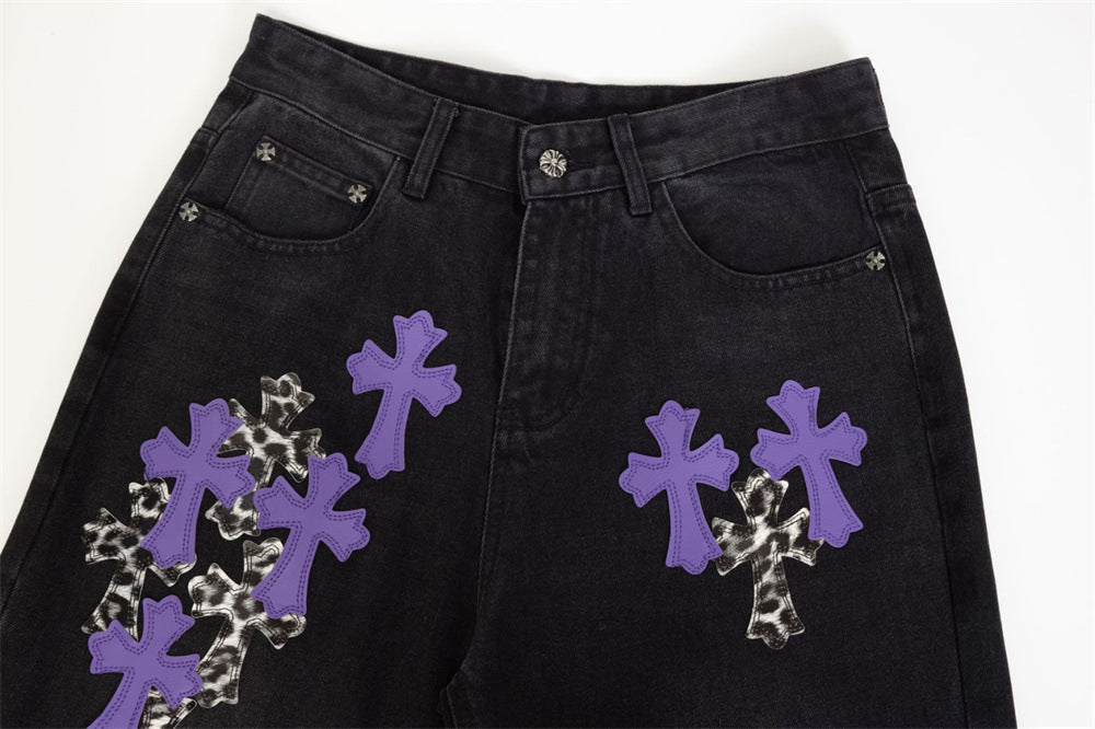 Black jeans waistband and front pockets with purple and leopard cross patches