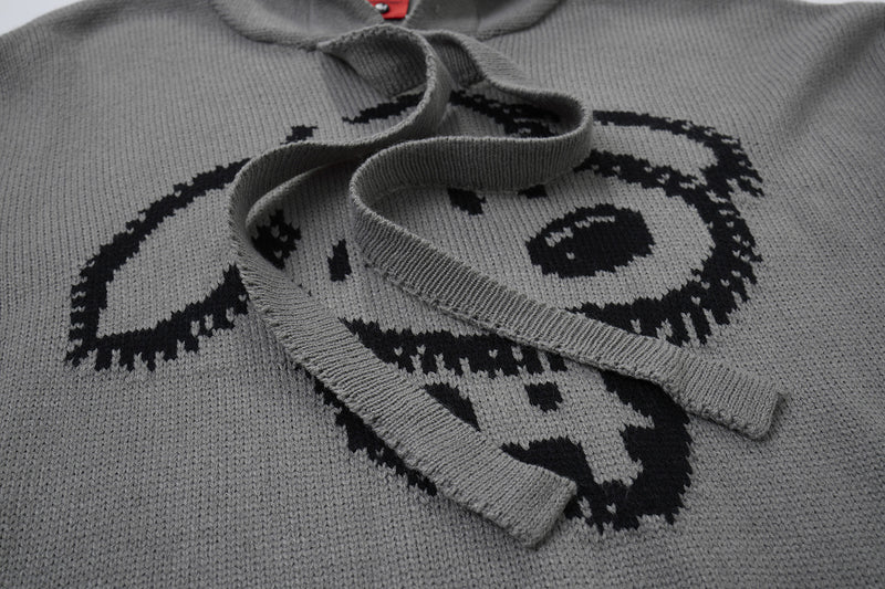 Pull à capuche oversize en maille jacquard avec grand motif graphique sur le devant