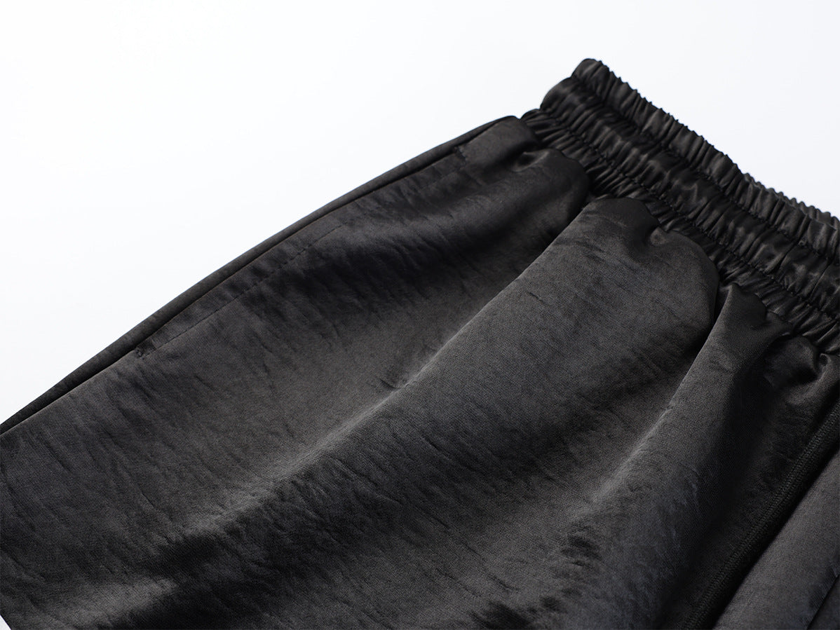 Pantalon de survêtement satiné à jambes larges – Imprimé graphique patchwork colorblock