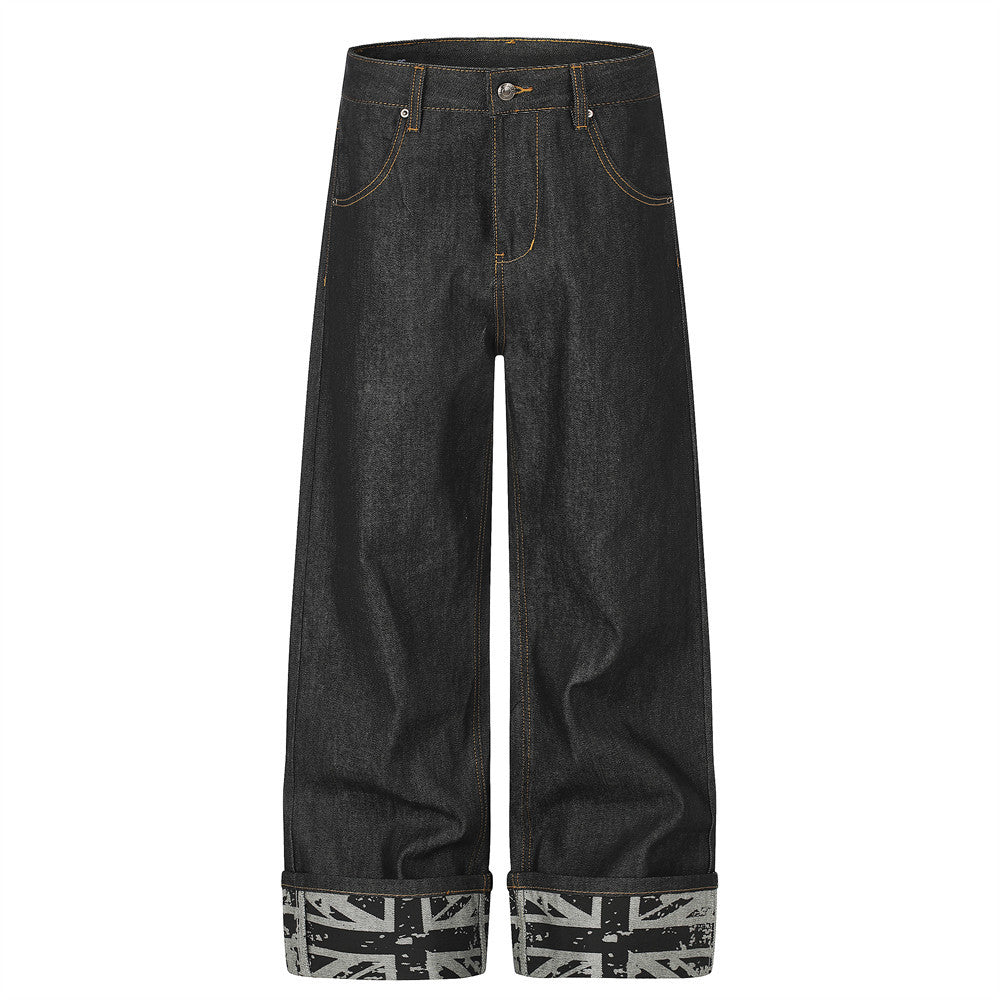 Jean homme à jambes larges – Denim noir, poches arrière cloutées et revers Union Jack