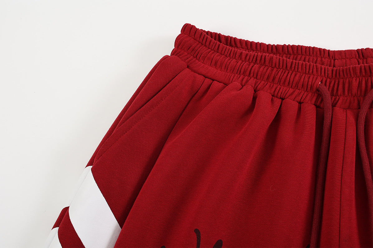 Pantalon de survêtement à jambes larges, rayures diagonales et lettrage – Coupe droite street