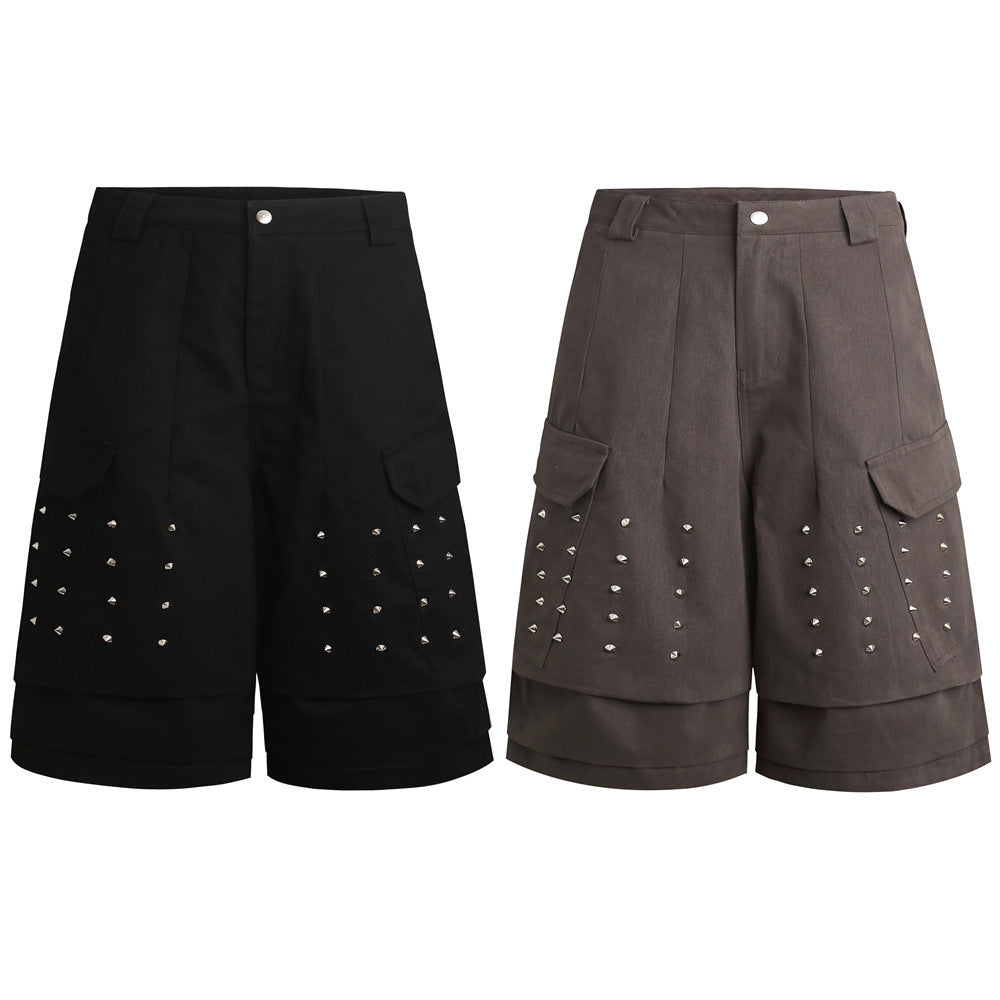 Black and brown cargo shorts with studded front panels and layered hems, shown side by side