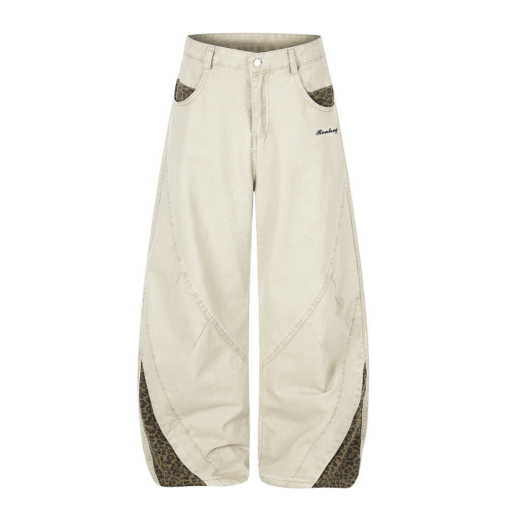 Pantalones de Pierna Ancha con Patchwork de Leopardo – Corte Baggy Deconstruido y Bajo Curvado