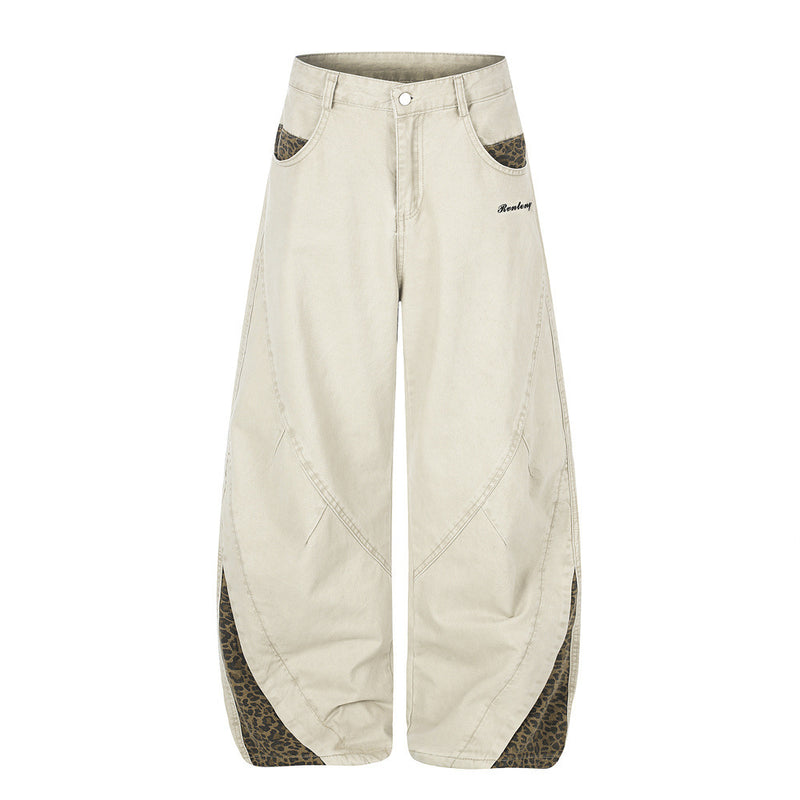 Pantalones de Pierna Ancha con Patchwork de Leopardo – Corte Baggy Deconstruido y Bajo Curvado