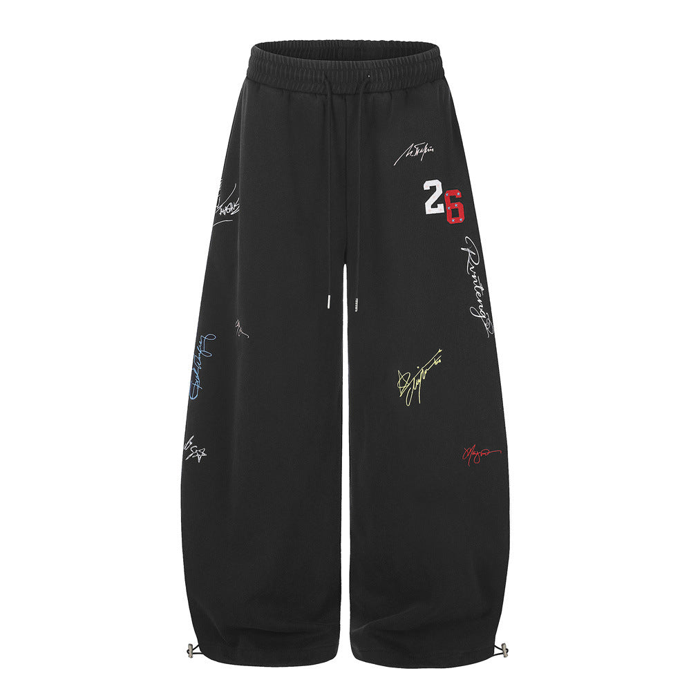 Oversized Wide-Leg-Sweathose in Schwarz mit mehrfarbiger Signaturstickerei und Chenille-Aufnäher mit Varsity-Nummer 26