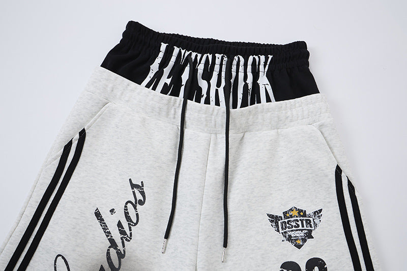 Wide-Leg-Sweatpants mit Colorblock-Doppelbund und Varsity-Grafikprint
