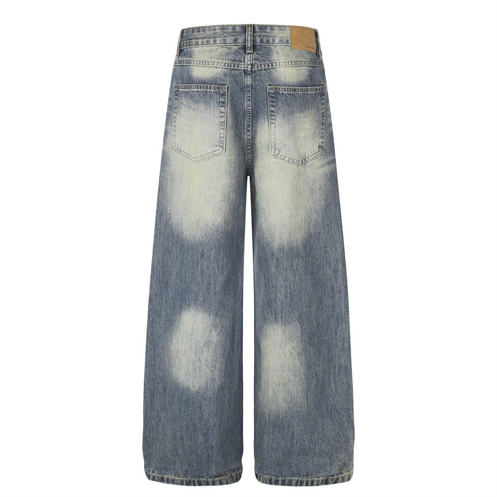 Jean homme coupe large – Denim délavé effet usé avec clous pyramidaux