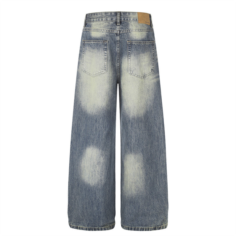 Jean homme coupe large – Denim délavé effet usé avec clous pyramidaux