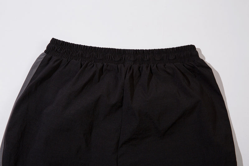 Herren-Trackpants mit kontrastierender Paspel und Colorblock-Seiteneinsätzen