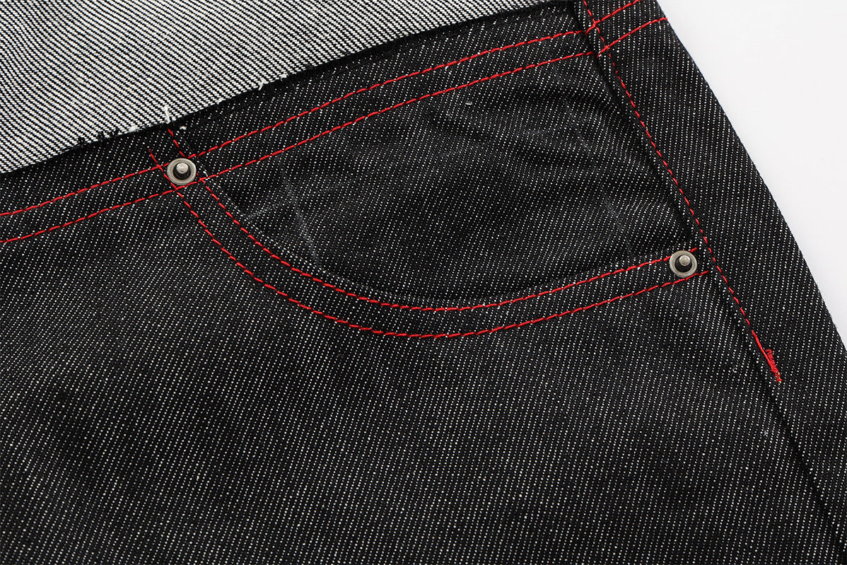 Jean wide leg bicolore à empiècements contrastants et broderie manuscrite – Coupe droite en denim brut