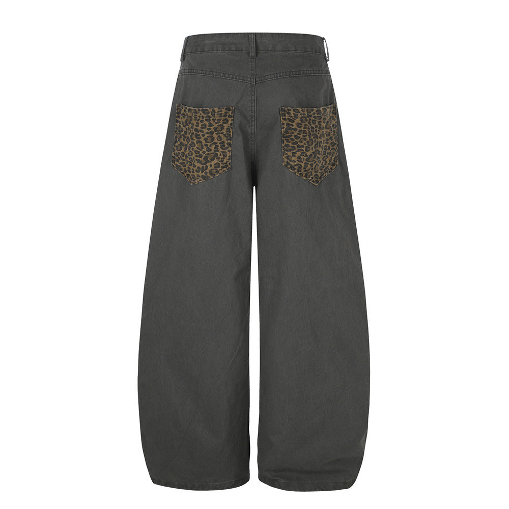 Pantalones de Pierna Ancha con Patchwork de Leopardo – Corte Baggy Deconstruido y Bajo Curvado