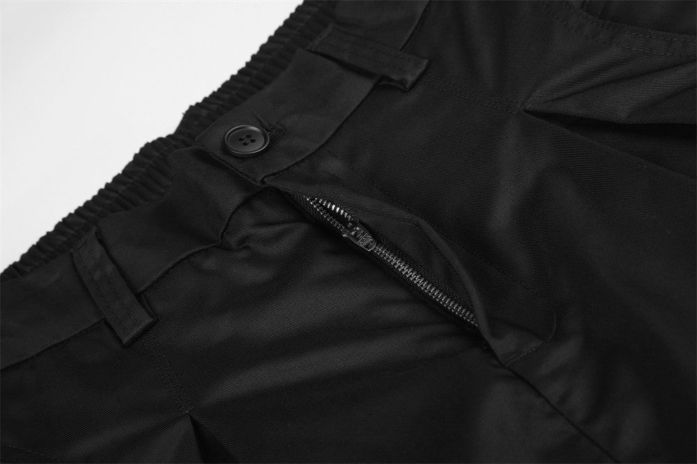 Wide-Leg Pleated Trousers – Oversized Silhouette with Curved Hem