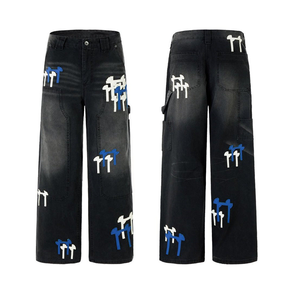 Black washed wide-leg cargo jeans with white and blue cross embroidery patches, front and back view
