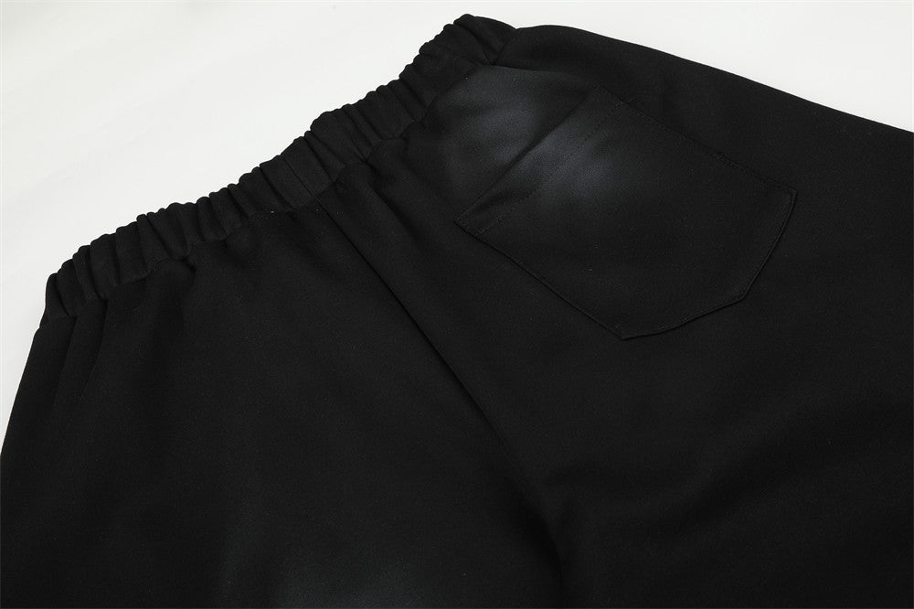 Pantalones de chándal holgados de pernera ancha con lavado efecto spray y gráfico de letras