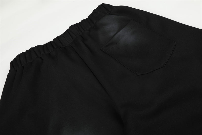 Pantalones de chándal holgados de pernera ancha con lavado efecto spray y gráfico de letras