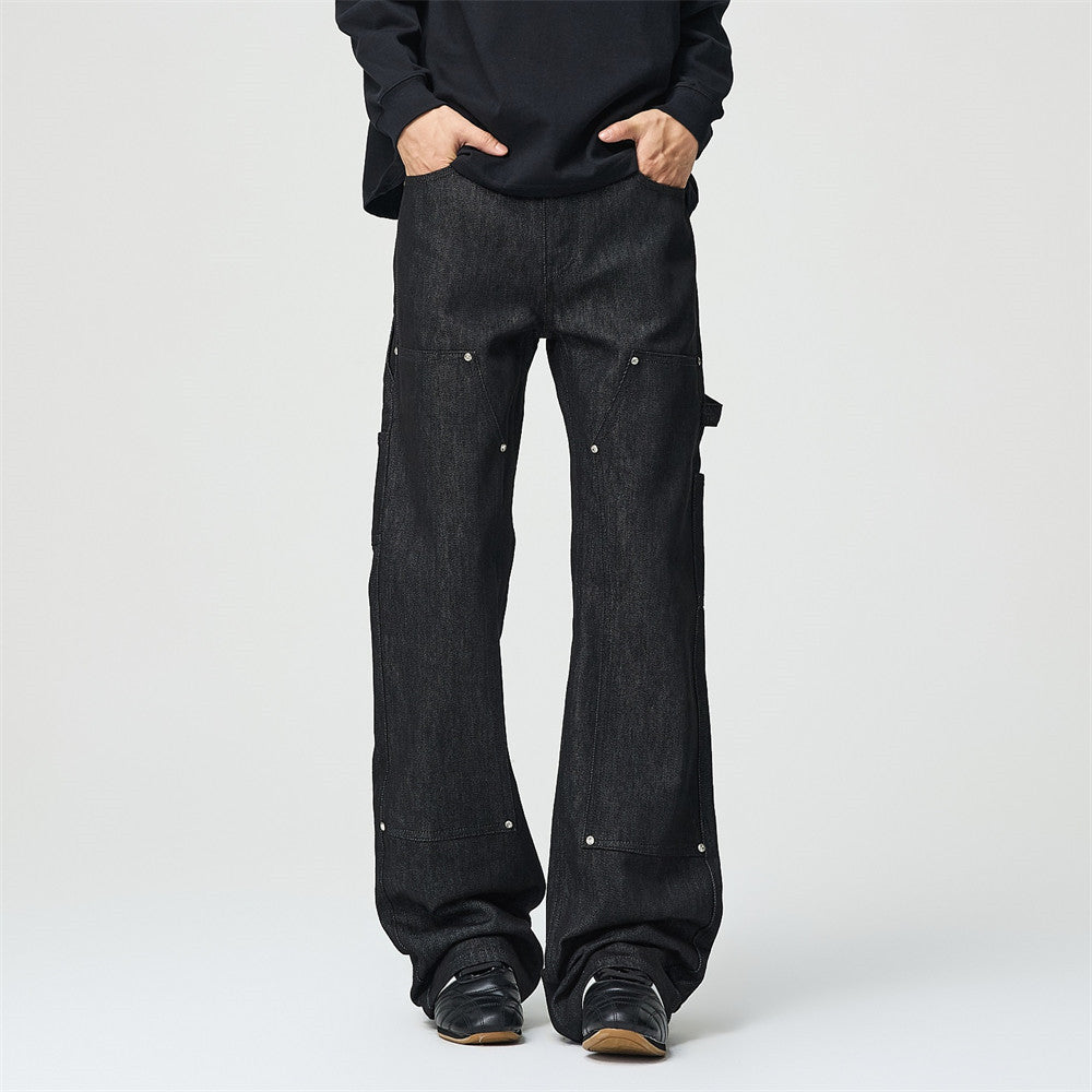 Black wide-leg cargo flare jeans with silver rivet hardware and knee panel overlays, front and back view