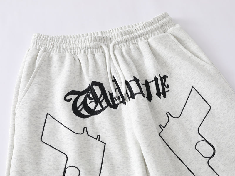 Pantalon de survêtement à jambes larges avec imprimé gothique « Welcome » et deux pistolets – Style streetwear hip-hop
