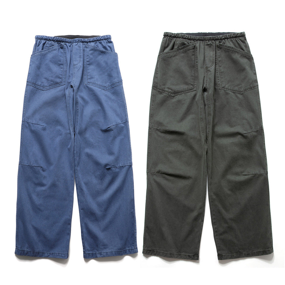 Baggy wide-leg men's cargo pants in washed blue and olive charcoal with elastic waist and front patch pockets
