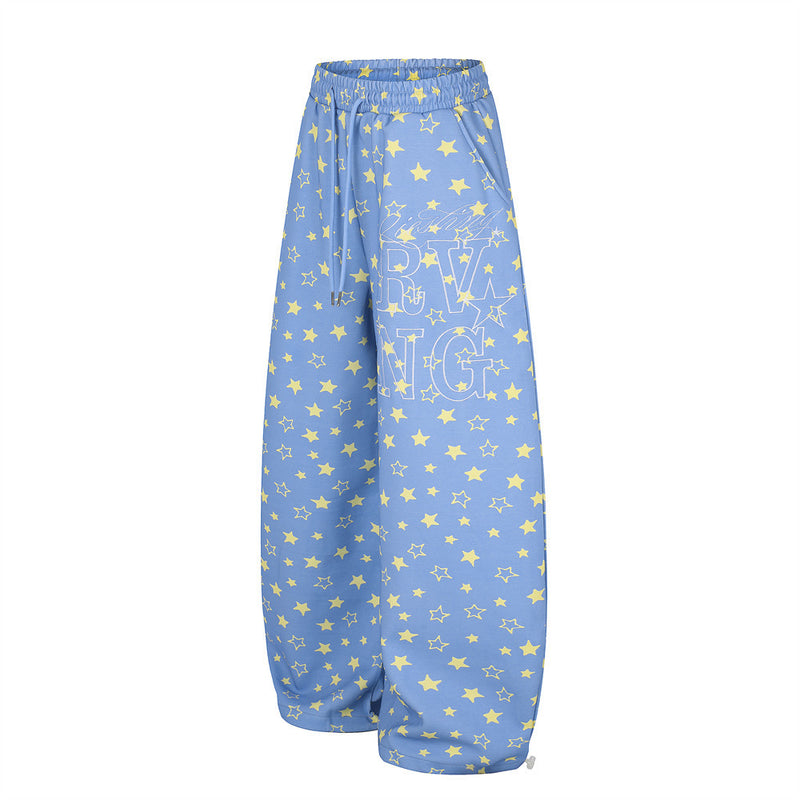 Blue wide leg star print sweatpants, angled front view with drawstring waistband
