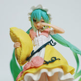 The Fairy Tale Sleeping Beauty Hatsune Miku 19cm PVC Figure is a cute collectible for Vocaloid fans. It shows Miku with turquoise hair in a white bonnet, pink and white top, yellow rose-adorned skirt, holding a yellow pillow while rubbing her eye. Comes packaged in a box.