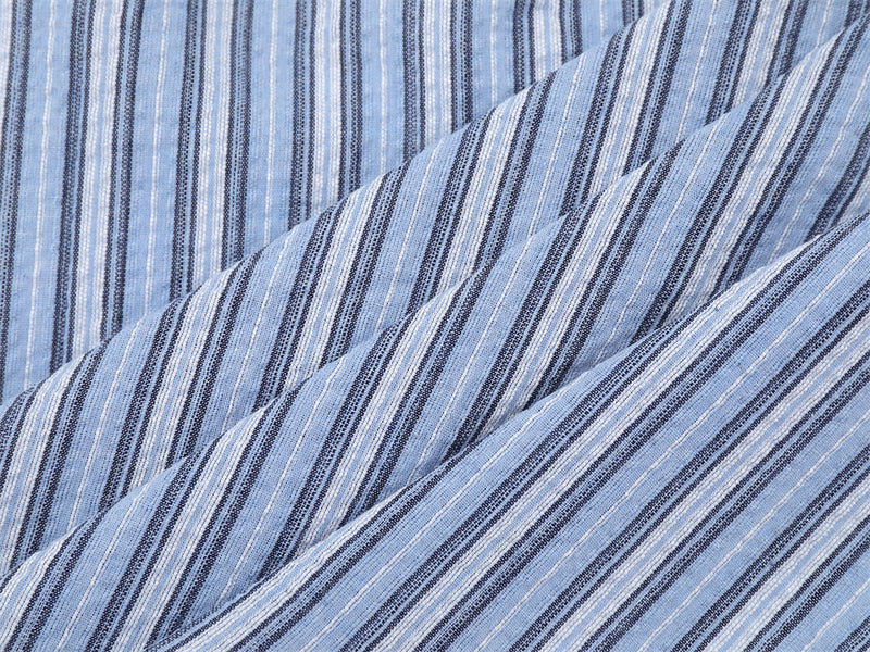 Blue striped shirt sleeve and body close-up with vertical stripe texture