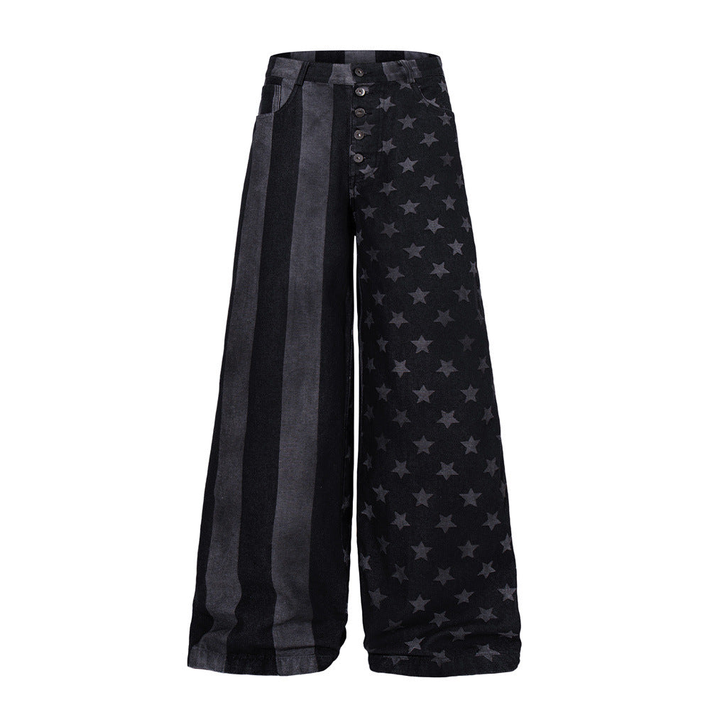 Wide-leg black distressed denim jeans with star print and vertical stripe panels, front and back view