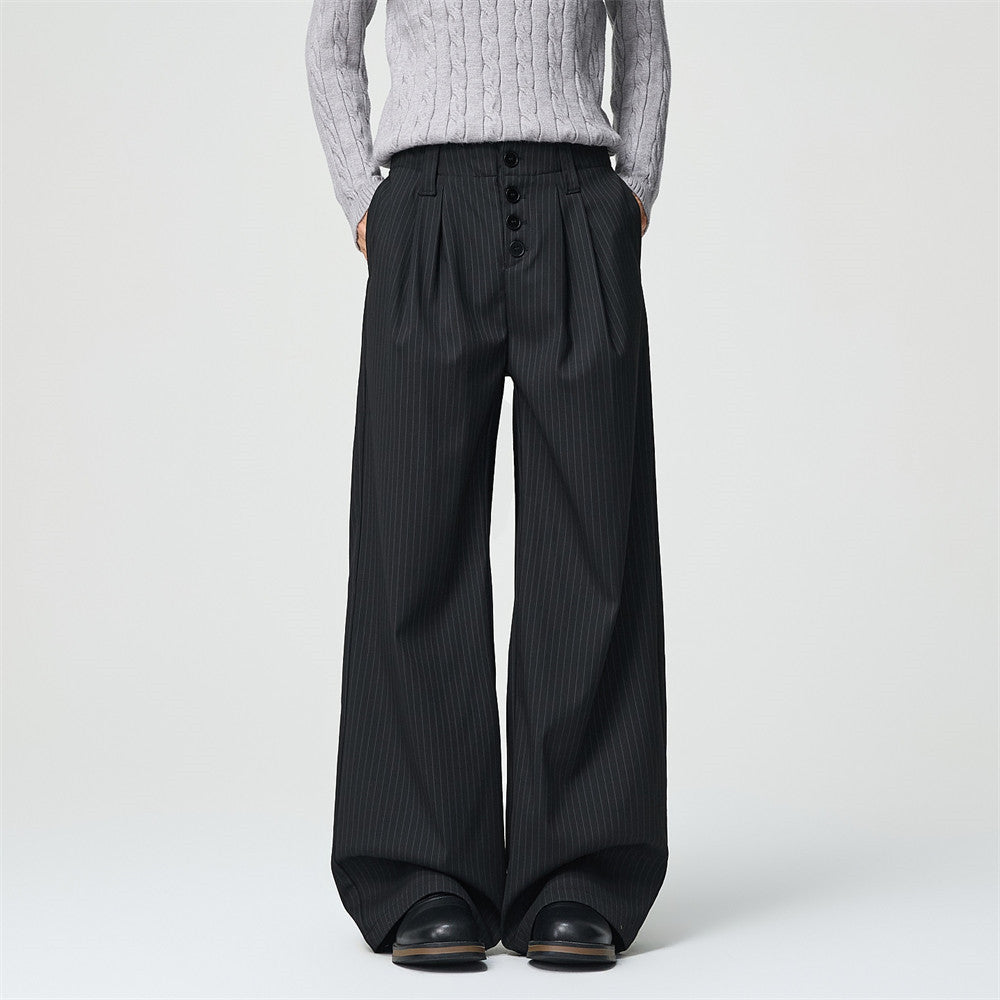 Men's black pinstripe wide-leg pleated trousers with exposed button fly, front and back view