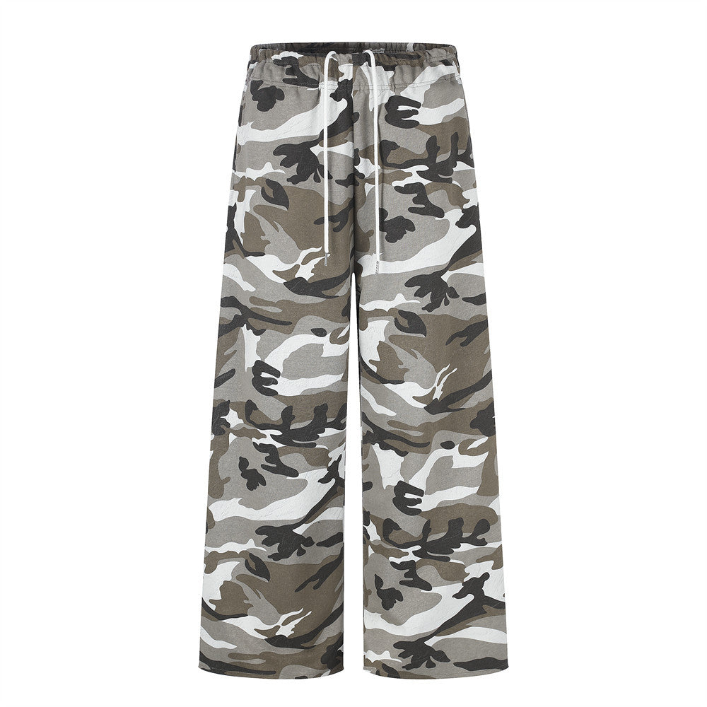 Men's wide-leg camouflage sweatpants with white drawstring waist in grey, olive, and black urban camo print