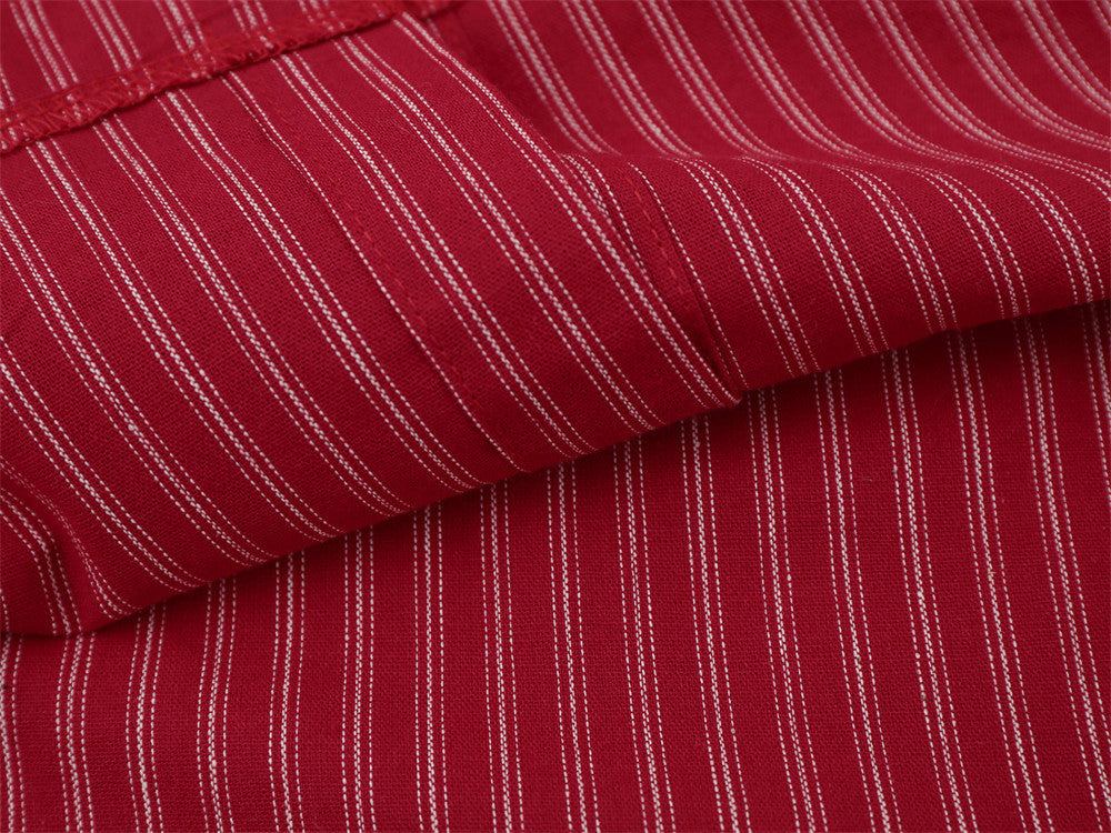 Close-up of red striped shirt sleeve fabric and seam detail