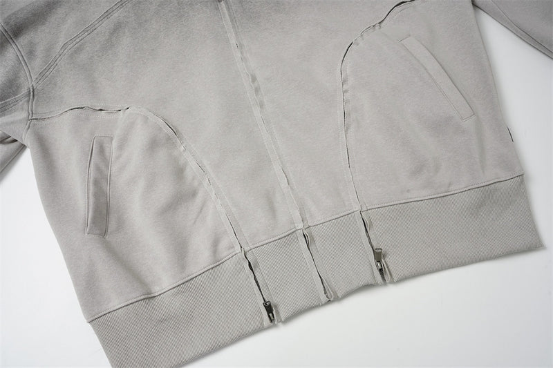 Sweat à capuche oversize zippé – Finition délavée usée, poches à multiples zips et bords bruts