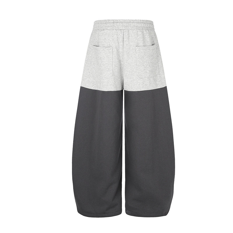 Gerade geschnittene Sweatpants – Colorblock-Baggy-Jogger mit Nieten-Grafik