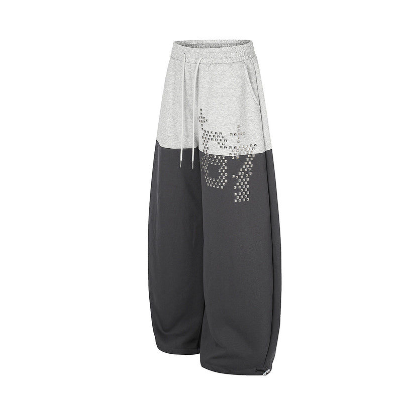Gerade geschnittene Sweatpants – Colorblock-Baggy-Jogger mit Nieten-Grafik