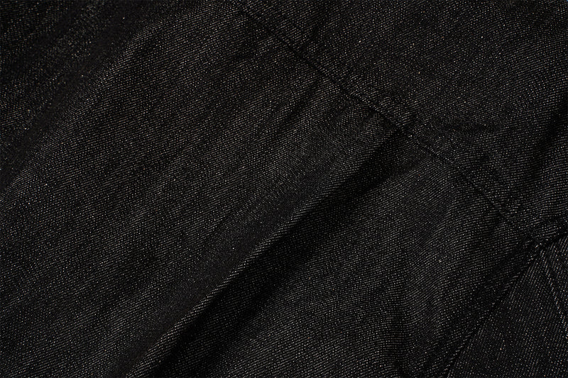 Veste en denim noir à devant plissé, fermetures à agrafes métalliques et clous turquoise