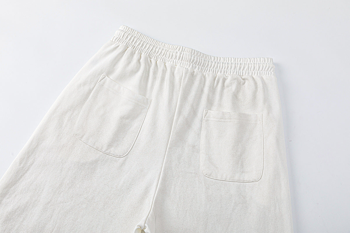 Pantalon de survêtement à jambes larges avec motif de notes de musique, coupe décontractée délavée