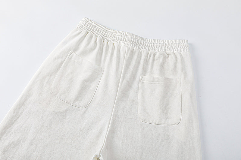 Pantalon de survêtement à jambes larges avec motif de notes de musique, coupe décontractée délavée